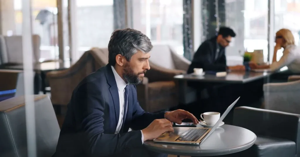 Man applying for a micro loan online on a laptop in Canada