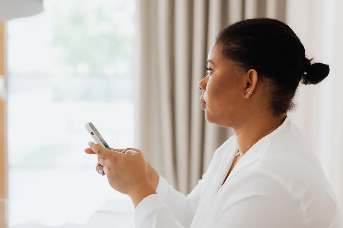 Toronto resident applying for a small loan on her phone